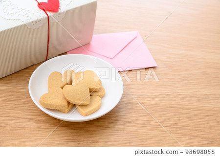 Heart-shaped handmade cookies on a white plate Valentine's Day White Day gift box 98698058