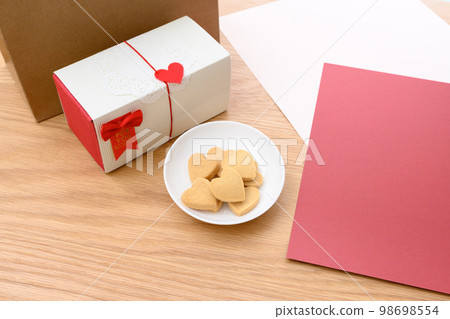 Heart-shaped handmade cookies on a white plate Valentine's Day White Day gift box 98698554