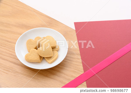 Heart-shaped handmade cookies on a white plate Valentine's Day White Day gift box 98698677