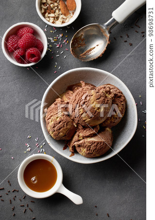 Ice cream ball with strawberry pieces Stock Photo by magone