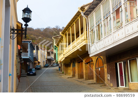 Narrow winding street of Signagi township with colorful houses Narrow winding street of Signagi township with colorful houses 98699559