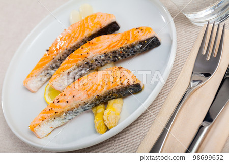 Appetizing roasted salmon Appetizing roasted salmon 98699652