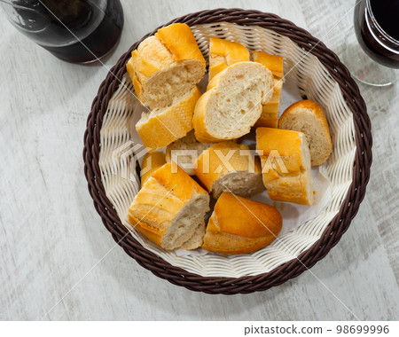 Served bread in wicker plate Served bread in wicker plate 98699996
