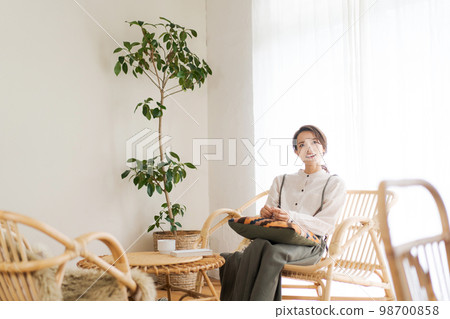 A woman relaxing in the room 98700858