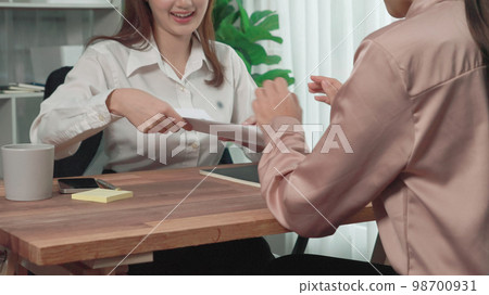 Closeup young and enthusiastic candidate interview with HR manager in office. 98700931