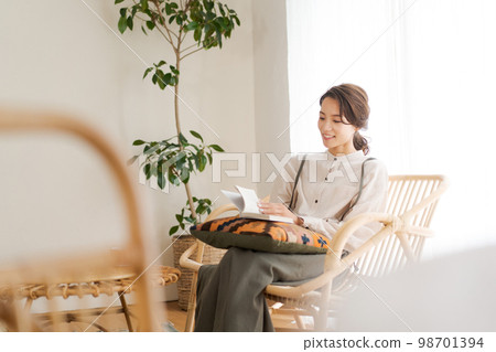 A woman relaxing in the room 98701394