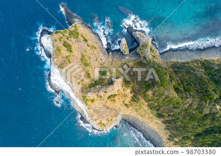 Aerial view of Keya no Daimon, a strangely shaped rock with columnar joints facing the Genkai Sea｜Drone shot｜Itoshima City, Fukuoka Prefecture 98703380