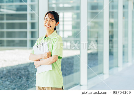 A young woman who is a care worker A young woman who is a care worker 98704309