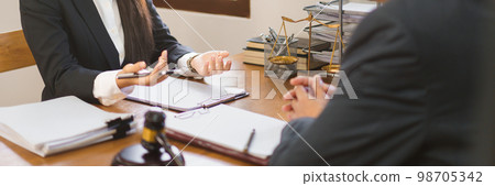 Legislation and justice concept, Female lawyer explains and consulting contract with senior lawyer Legislation and justice concept, Female lawyer explains and consulting contract with senior lawyer 98705342