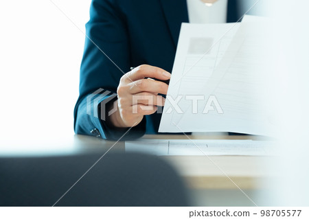Personnel officer looking at application documents Personnel officer looking at application documents 98705577