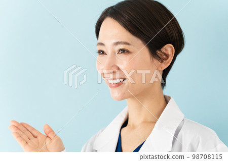 Young woman wearing a white coat medical image 98708115