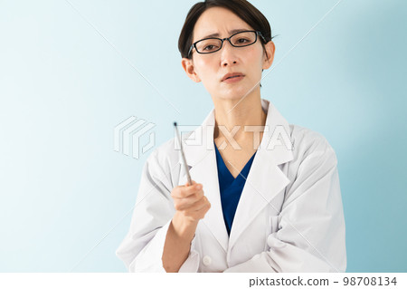 Young woman wearing a white coat medical image Young woman wearing a white coat medical image 98708134