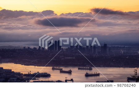 Developed city with industrial and residential buildings. Clouds in Background. Developed city with industrial and residential buildings. Clouds in Background. 98708240