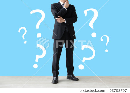 A man in a suit with doubts 98708797