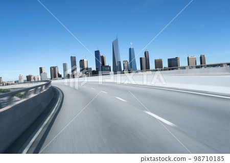 3d rendering Highway overpass motion blur with modern city 98710185