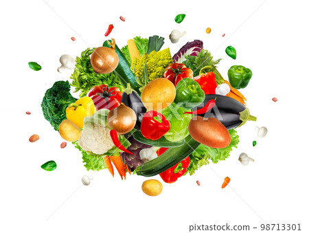 Collection of tasty fresh vegetables mix explosion on an isolated white background. Collection of tasty fresh vegetables mix explosion on an isolated white background. 98713301