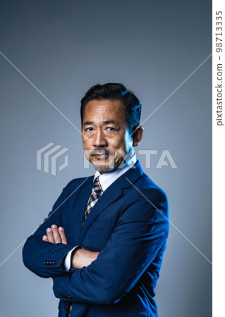 Portrait of a bitter middle-aged businessman 98713335