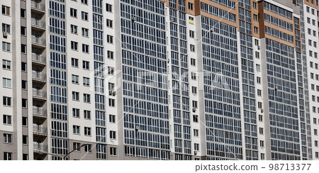 many windows and balconies on the facade many windows and balconies on the facade 98713377