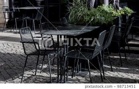 Cozy street with tables of cafe Cozy street with tables of cafe 98713451