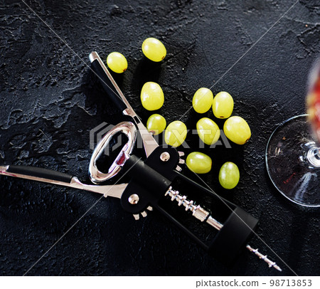 black corkscrew and grapes black corkscrew and grapes 98713853