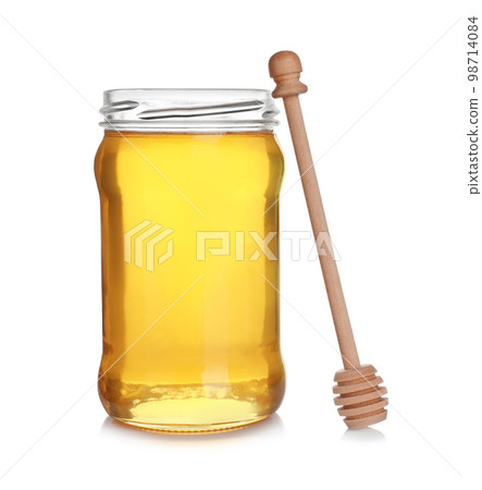 Jar of organic honey and dipper isolated on white 98714084