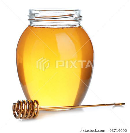 Jar of organic honey and dipper isolated on white Jar of organic honey and dipper isolated on white 98714090