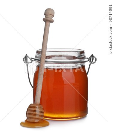 Jar of organic honey and dipper isolated on white Jar of organic honey and dipper isolated on white 98714091