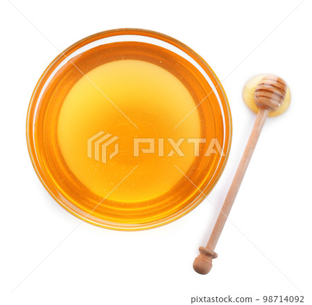 Bowl of organic honey and dipper isolated on white, top view Bowl of organic honey and dipper isolated on white, top view 98714092