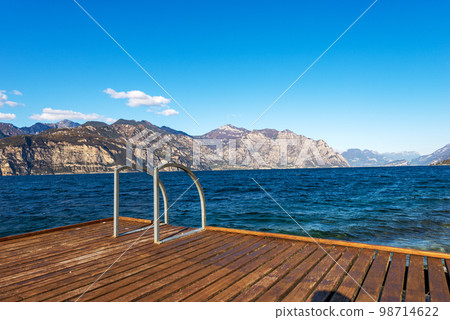 Wooden Pier on Lake Garda - Malcesine and Limone sul Garda Italy Wooden Pier on Lake Garda - Malcesine and Limone sul Garda Italy 98714622