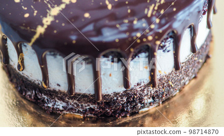 dark chocolate frosted drip cake with best wishes topping written in italian dark chocolate frosted drip cake with best wishes topping written in italian 98714870