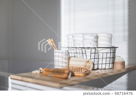 Bathroom domestic spa procedure body care tools arrangement minimal ecology space organization 98716476