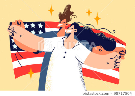 Happy couple holding American flag in hands  98717804