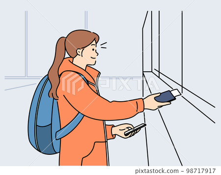 Smiling girl buy tickets at railway station 98717917
