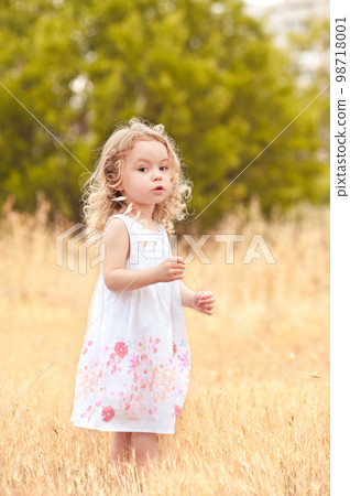 Little baby girl 2-3 year old walking in... - Stock Photo [98718001] - PIXTA