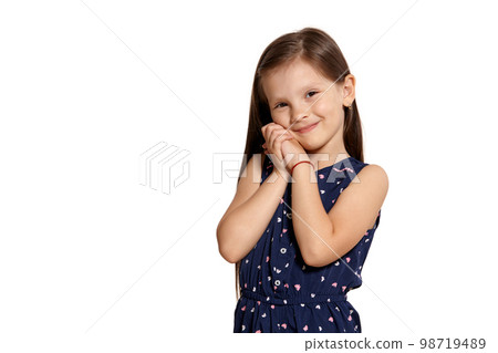Close-up studio shot of beautiful brunette little girl posing isolated on white studio background. Close-up studio shot of beautiful brunette little girl posing isolated on white studio background. 98719489