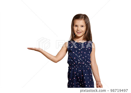 Close-up studio shot of beautiful brunette little girl posing isolated on white studio background. 98719497