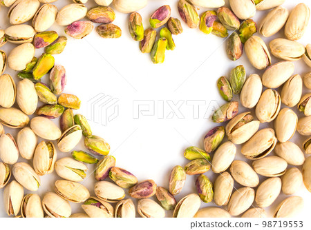 roasted nuts on a whiroasted salted pistachio nuts on a white background and place for inscription in form of heartte background and place for inscription roasted nuts on a whiroasted salted pistachio nuts on a white background and place for inscription in form of heartte background and place for inscription 98719553