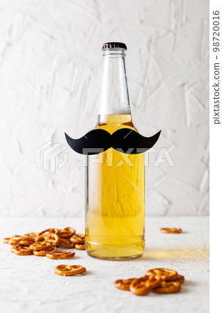 Bottle of beer with moustache. Movember. Concept of father's day, bachelor party. 98720016