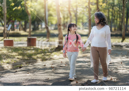 Asian Grandmother and Granddaughter walking together outdoor park. Hobbies and leisure, lifestyle, family life, happiness moment concept Asian Grandmother and Granddaughter walking together outdoor park. Hobbies and leisure, lifestyle, family life, happiness moment concept 98721114