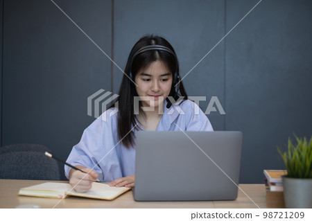 E-learning ,online ,education and internet social distancing protect from COVID-19 viruses concept. Asian woman student video conference e-learning with teacher on laptop computer at home. 98721209