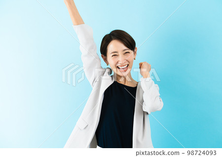 A young woman who is happy with her arms raised Business image A young woman who is happy with her arms raised Business image 98724093
