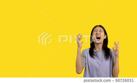 Close up isolated portrait of woman was angry and angry like crazy, Screaming with frustration, Yelling with extreme hate, Expressing negative emotions and pessimism, Mental illness. 98726031