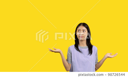 Woman doing boring poses on colored background, Acting indifferently, Indifferent to what is going on, Acting not concerned, Yellow background, Ignorant, Up to you. Woman doing boring poses on colored background, Acting indifferently, Indifferent to what is going on, Acting not concerned, Yellow background, Ignorant, Up to you. 98726544