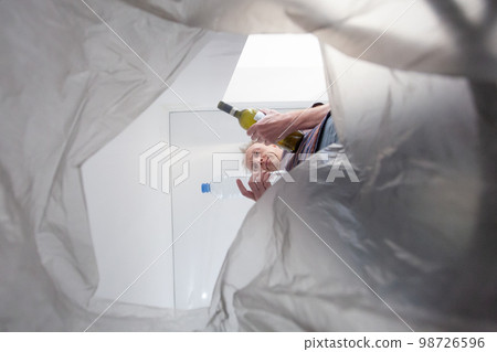 Recycle bin concept. Man throwing garbage in a trash bin 98726596