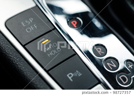 Auto hold button in a modern vehicle turned on 98727357