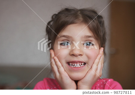 Funny girl 5 years old covered her face with her palms at home Funny girl 5 years old covered her face with her palms at home 98727811