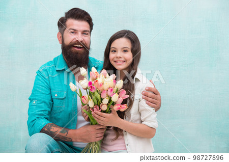 tulip bouquet. portrait of family, daughter and father. Father and little girl enjoy spring. happy womens day on 8 march. birthday surprise for her. fathers day concept. family bonding time tulip bouquet. portrait of family, daughter and father. Father and little girl enjoy spring. happy womens day on 8 march. birthday surprise for her. fathers day concept. family bonding time 98727896