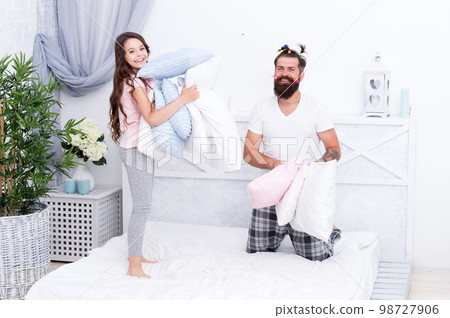 Daughter is his love. Small daughter and bearded man have fun. Little daughter and father enjoy playing games together. Father and daughter relationship. Happy family. Daughters day 98727906