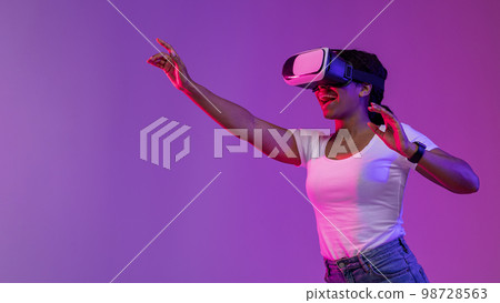Virtual Reality Experience. Excited Black Woman Playing Video Game In VR Glasses 98728563