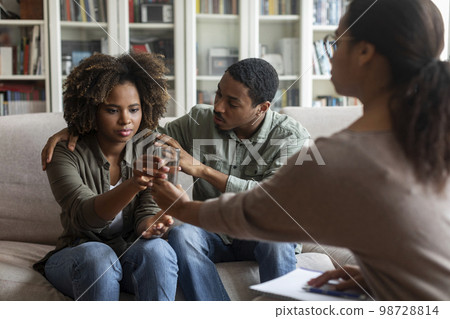 Young black couple visit family psychologist together Young black couple visit family psychologist together 98728814